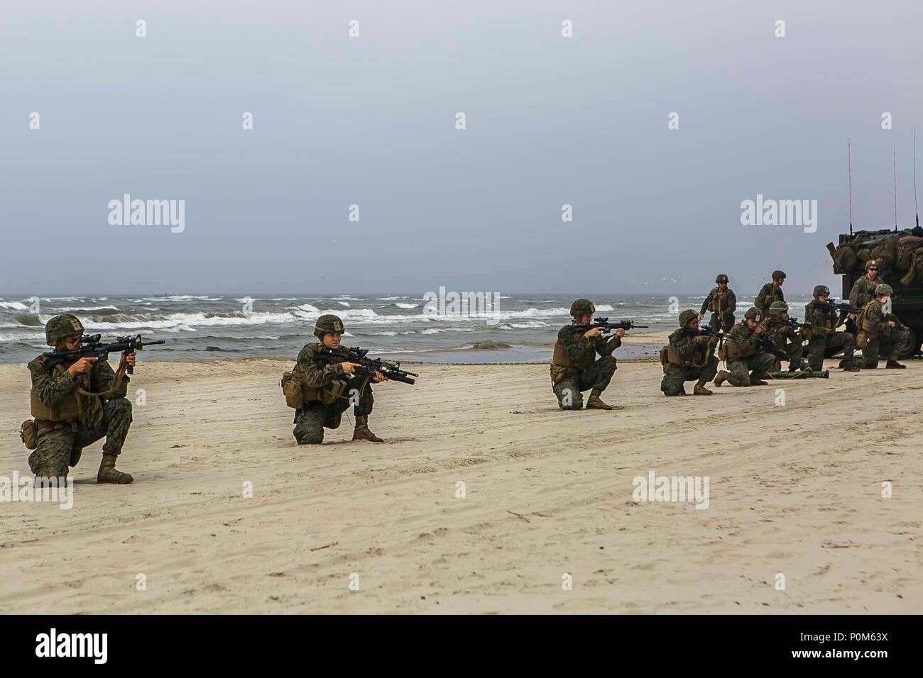 NEMERSITA, Lithuania (June 4, 2018) U.S. Marines assigned to Fox Company, Battalion Landing Team, 2nd Battalion, 6th Marine Regiment, 26th Marine Expeditionary Unit, execute a multilateral amphibious landing during exercise Baltic Operations (BALTOPS) 2018 in Nemersita, Lithuania, June 4. BALTOPS is the premier annual maritime-focused exercise in the Baltic region and one of the largest exercises in Northern Europe enhancing flexibility and interoperability among allied and partner nations. (Marine Corps photo by Staff Sgt. Dengrier M. Baez/Released) Stock Photo
