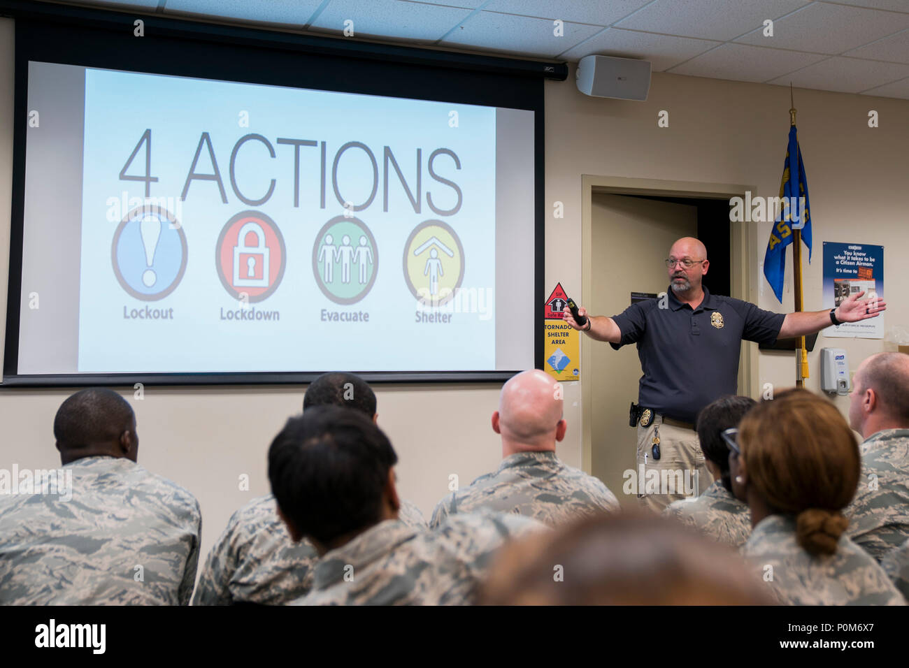 Specialized Parole Officer Phil Burrell discusses active shooter response methods with Reserve Citizen Airmen of the 413th Aeromedical Staging Squadron June 2, 2018, at Robins Air Force Base, Georgia. Burrell works with the Albany Transitional Center and visited the unit to provide strategies and guidance on surviving an active shooter event. (U.S. Air Force photo by Jamal D. Sutter) Stock Photo
