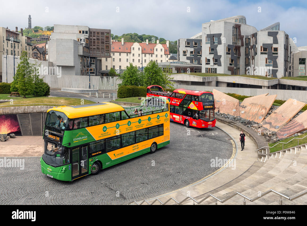 Sightseeing buses in front of science museum Dynamic Earth Edinburgh Stock Photo