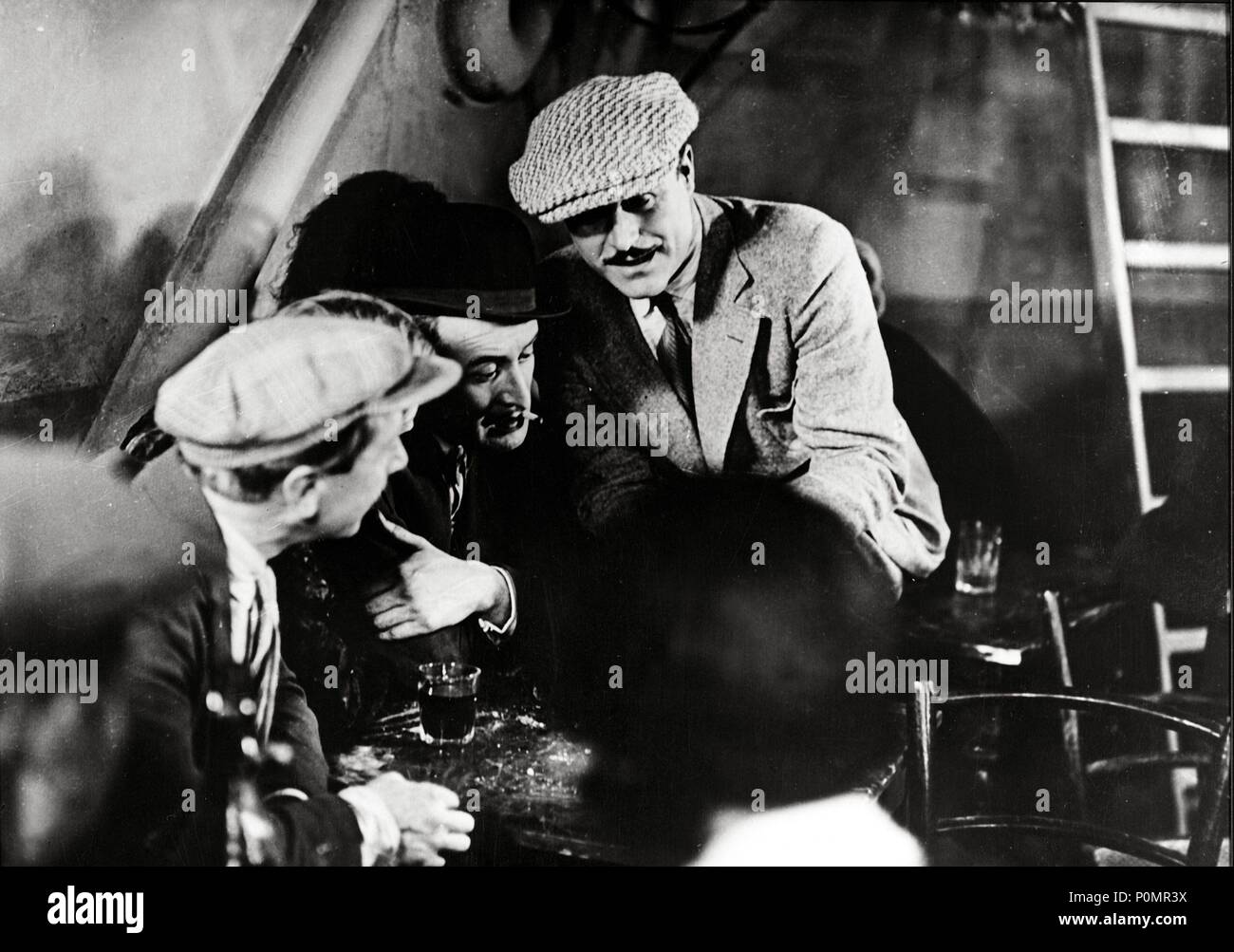 Original Film Title: SOUS LES TOITS DE PARIS.  English Title: UNDER THE ROOFS OF PARIS.  Film Director: RENE CLAIR.  Year: 1930.  Stars: GASTON MODOT. Stock Photo