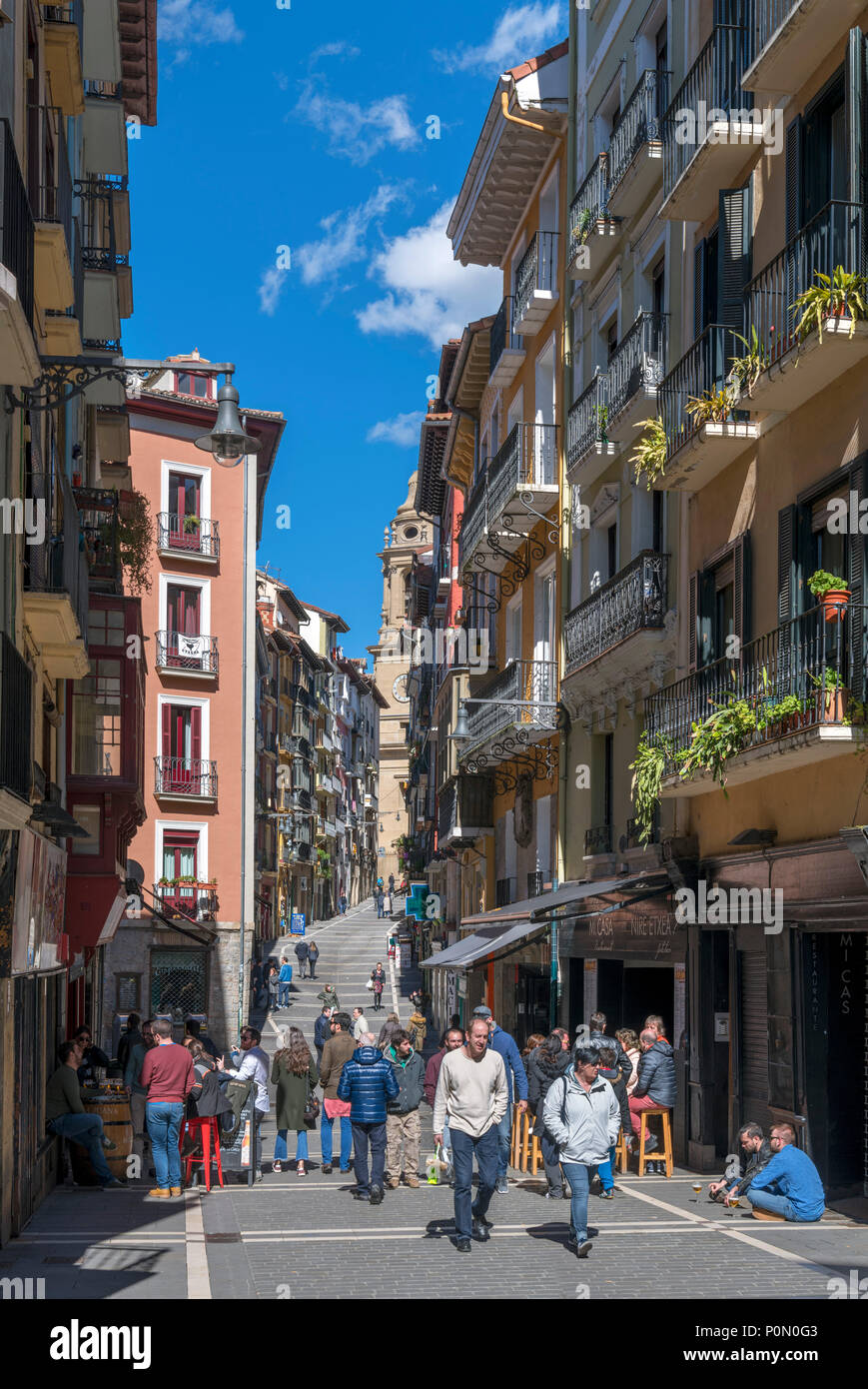 Pamplona, Spain. Bars, shops and cafes on Calle Mercaderes looking towards the cathedral, Casco Antiguo (old town), Pamplona, Navarra, Spain Stock Photo