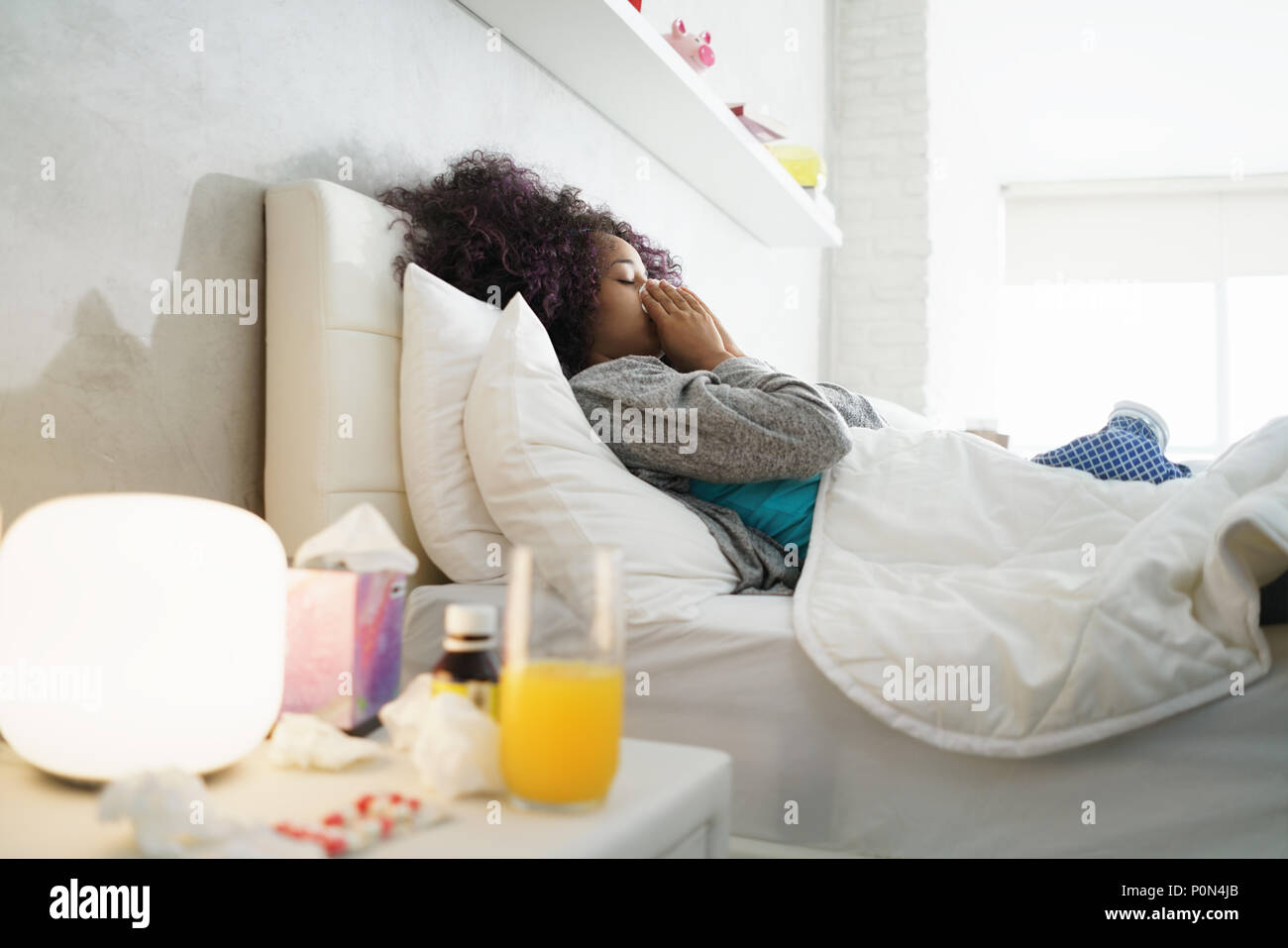 Black Woman With Flu And Cold Holding Ice Bag Stock Photo
