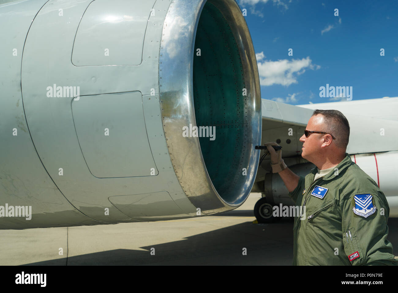 U.S. Air Force Tech. Sgt. Kevin Kieffer, a flight engineer with the 116th Air Control Wing (ACW), Georgia Air National Guard, inspects an engine inlet during a pre-flight inspection on an E-8C Joint STARS prior to flying a mission in support of BALTOPS and Saber Strike 18 exercises at Fighter Wing Skrydstrup, Denmark, June 5, 2018. The JSTARS team consists of the Georgia Air National Guard’s 116th ACW, plus active duty personnel assigned to the 461st ACW and Army JSTARS. They are in Denmark to participate in Exercise Baltic Operations, or BALTOPS, June 4-15 and Saber Strike 18 from June 3-15.  Stock Photo