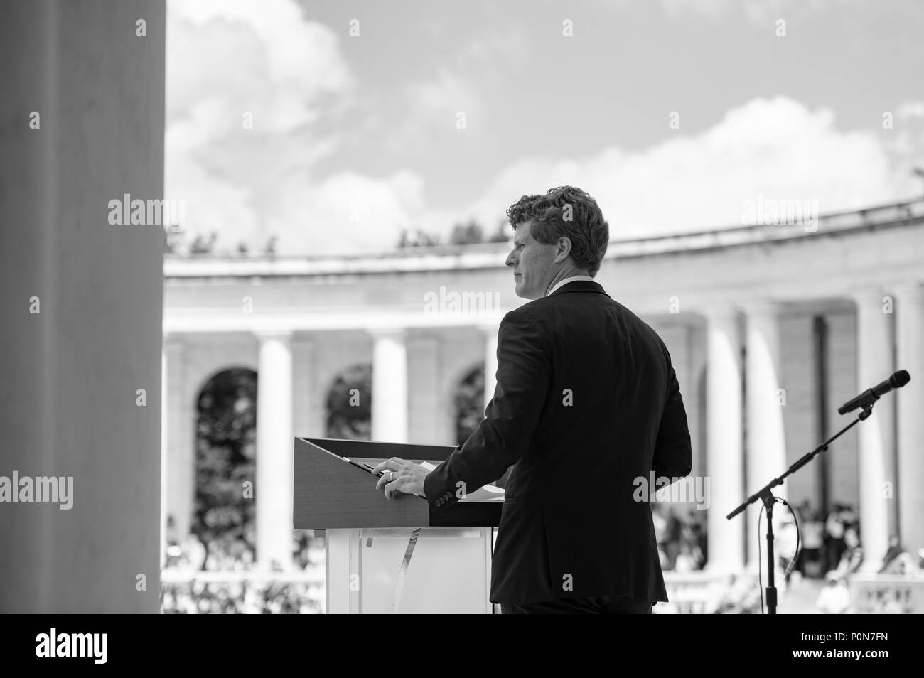 U.S. Rep. Joe Kennedy III speaks during a ceremony celebrating the life of his grandfather, Sen. Robert F. Kennedy, on the 50th anniversary of Sen. Kennedy's assassination, in the Memorial Amphitheater at Arlington National Cemetery, Arlington, Virginia, June 6, 2018. The ceremony was open to the public and attended by former President Bill Clinton, Ethel Kennedy, Kathleen Kennedy Townsend, and U.S. Rep. John Lewis, among others. (U.S. Army photo by Elizabeth Fraser / Arlington National Cemetery / released) (This image was created in color and changed to black-and-white) Stock Photo