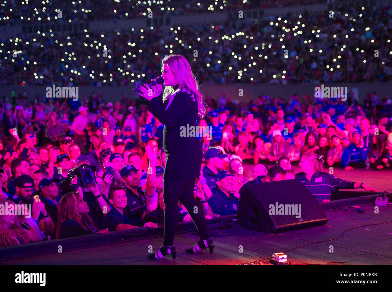 Music artist Kelly Clarkson performs for an audience at the DoD Warrior