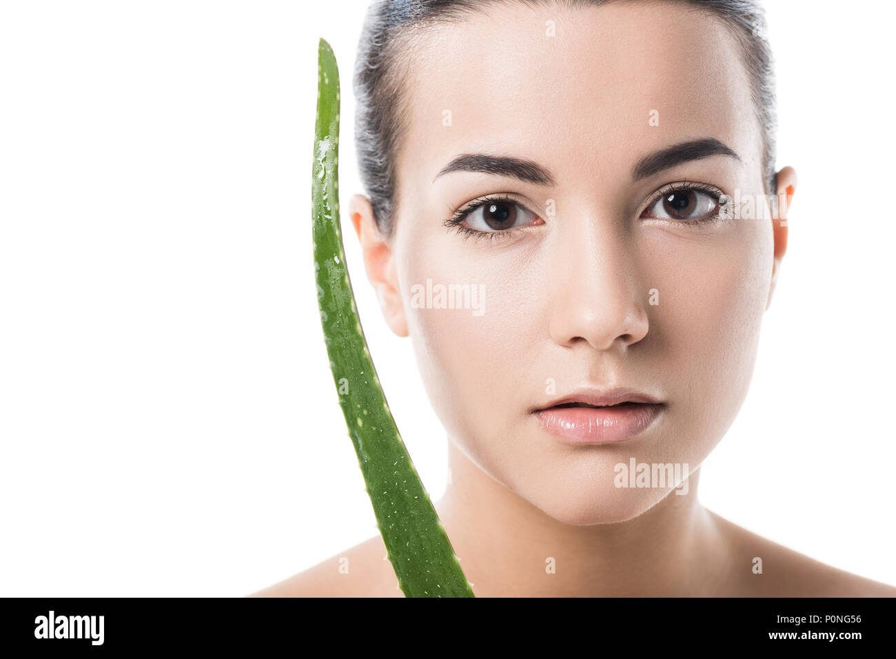 beautiful girl holding aloe vera leaf near face isolated on white Stock