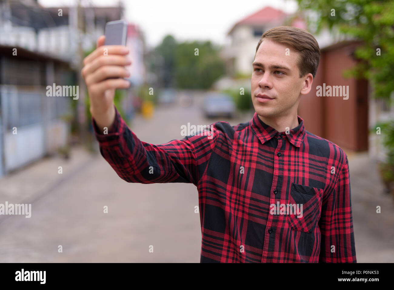 Man taking selfie outdoors Stock Photo
