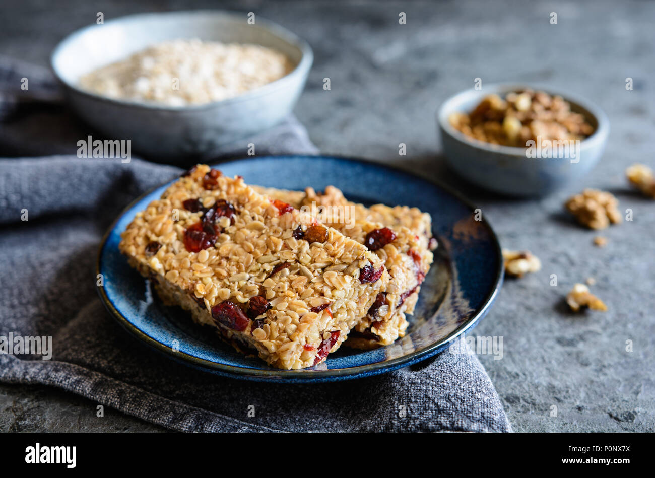Healthy granola bars with cranberries, walnuts, sunflower seeds and