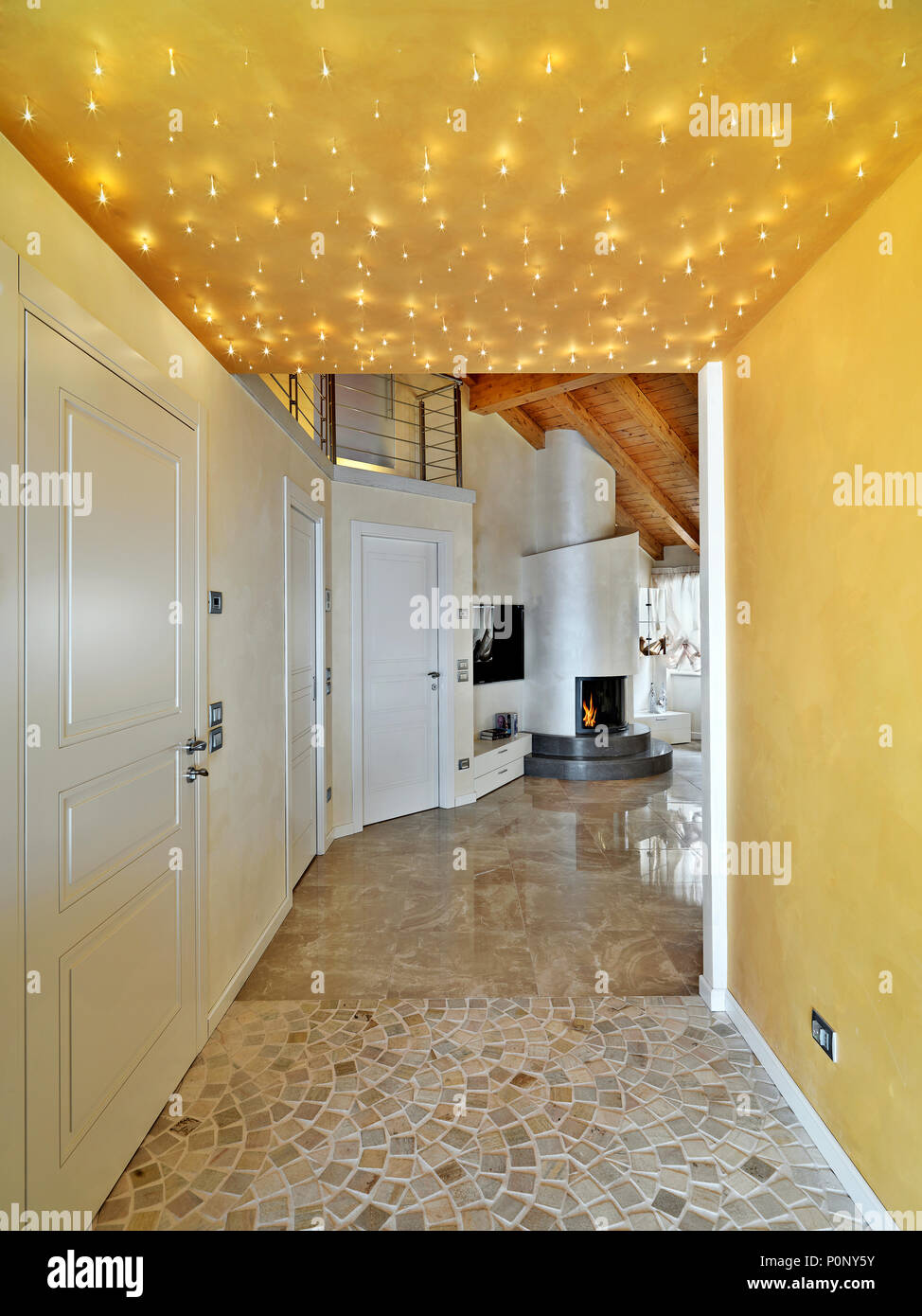 modern entrance of attic room overlooking on the living room in the ...