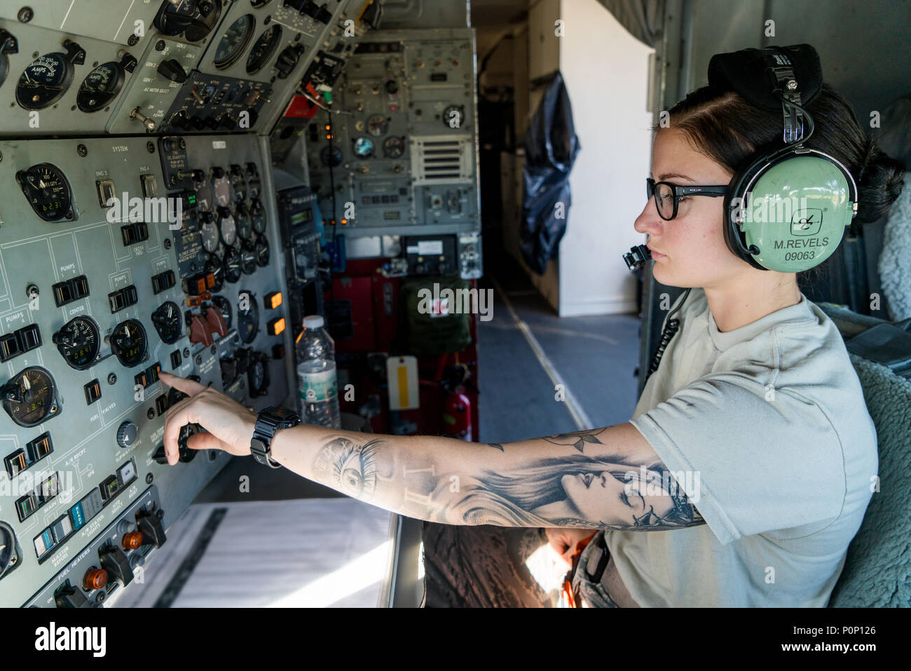 U.S. Air Force Senior Airman Morgan Revels, a crew chief with the 461st Air  Control Wing (ACW), operates the interior fuel panel while servicing a E-8C  Joint STARS participating in BALTOPS and