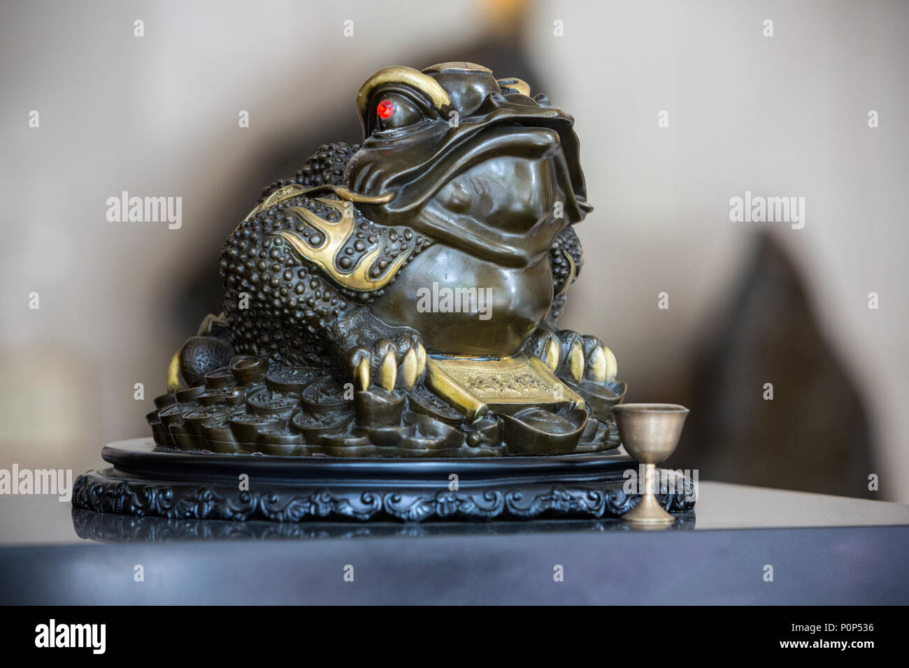 Suzhou, Jiangsu, China.  Replica of a Toad on a Hotel Check-in Desk, a Traditional Symbol of Prosperity. Stock Photo