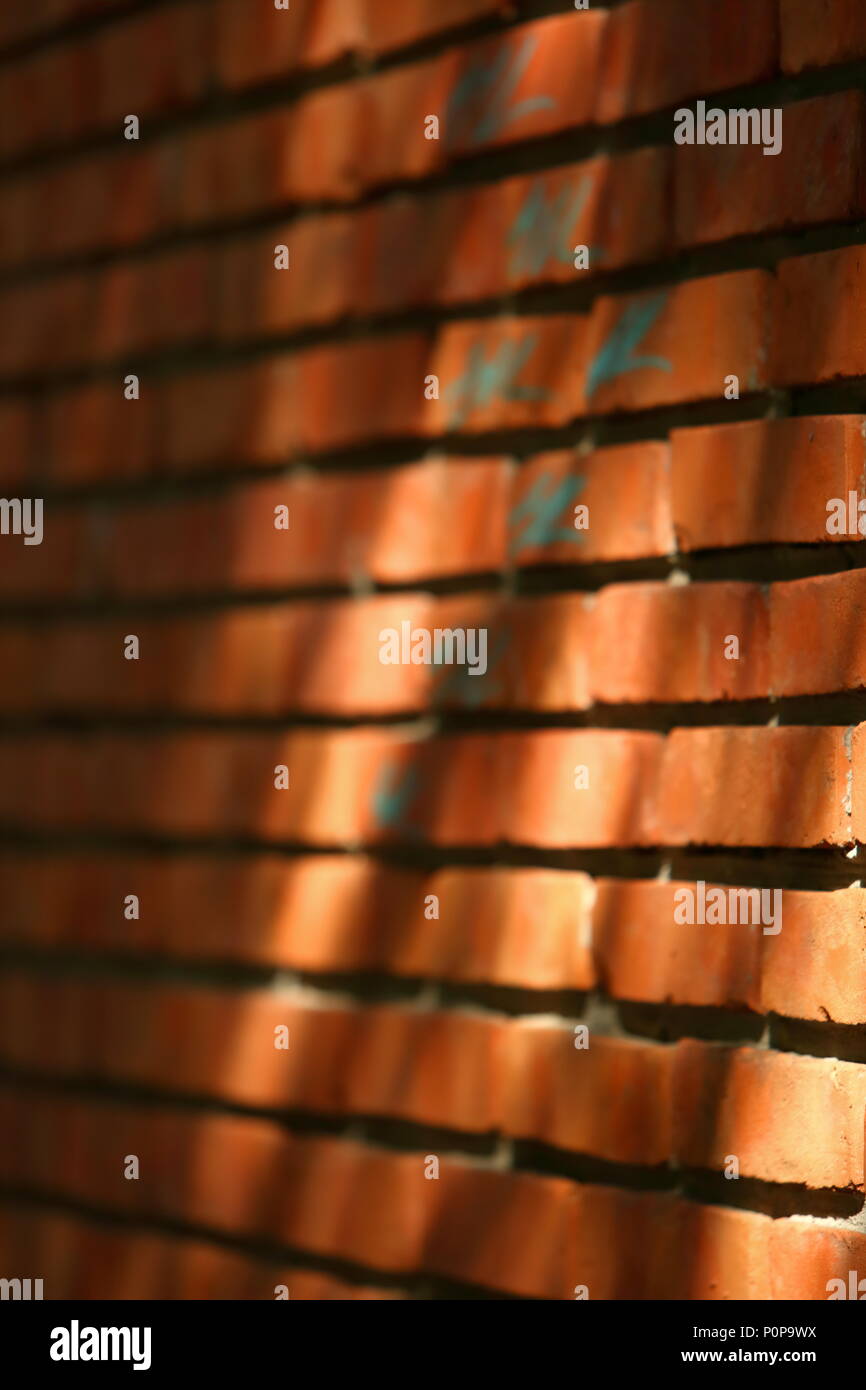 Wall made of red bricks. Stock Photo