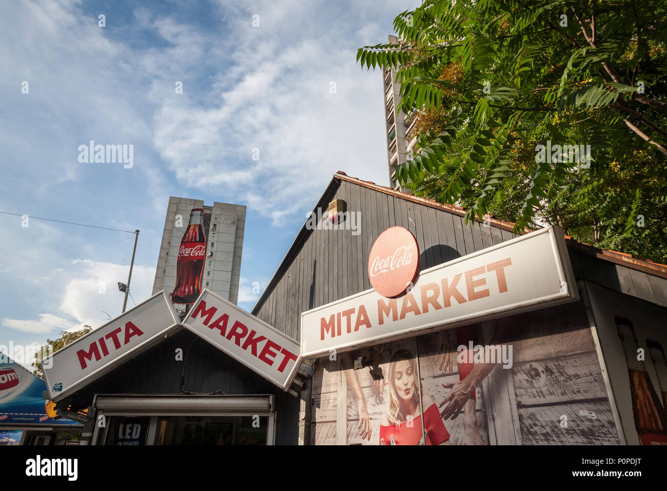 BELGRADE, SERBIA - JUNE 06, 2018: Coca Cola logo on a small market sponsored by the beverage brand. Coca Cola Company is one of the biggest soft drink Stock Photo