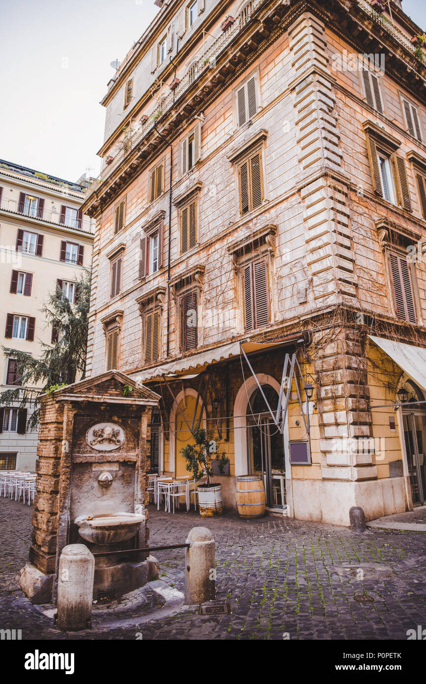 ancient Aqua Marcia aqueduct and buildings in Rome, Italy Stock Photo