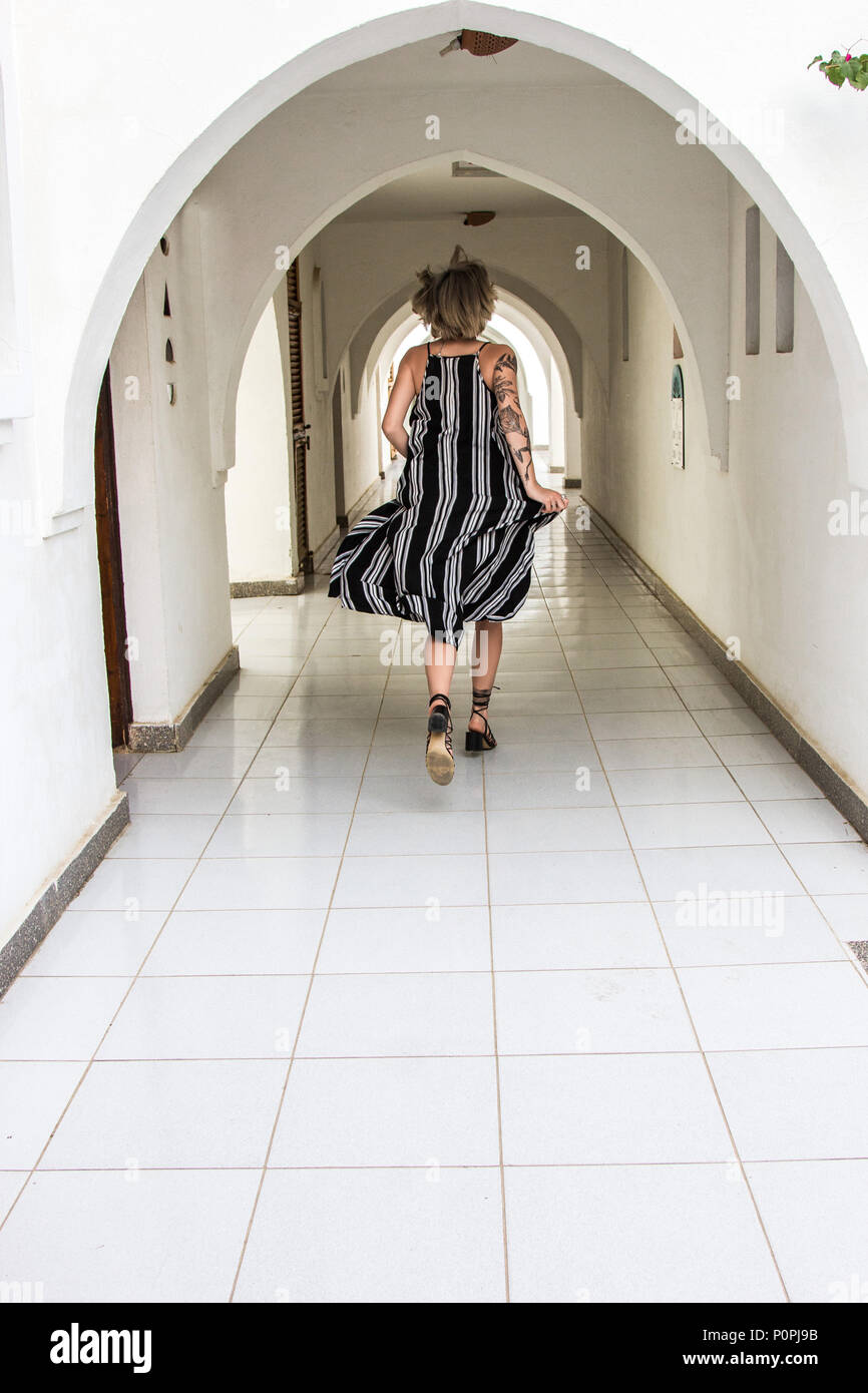 Woman running dress rear view hi-res stock photography and images - Alamy