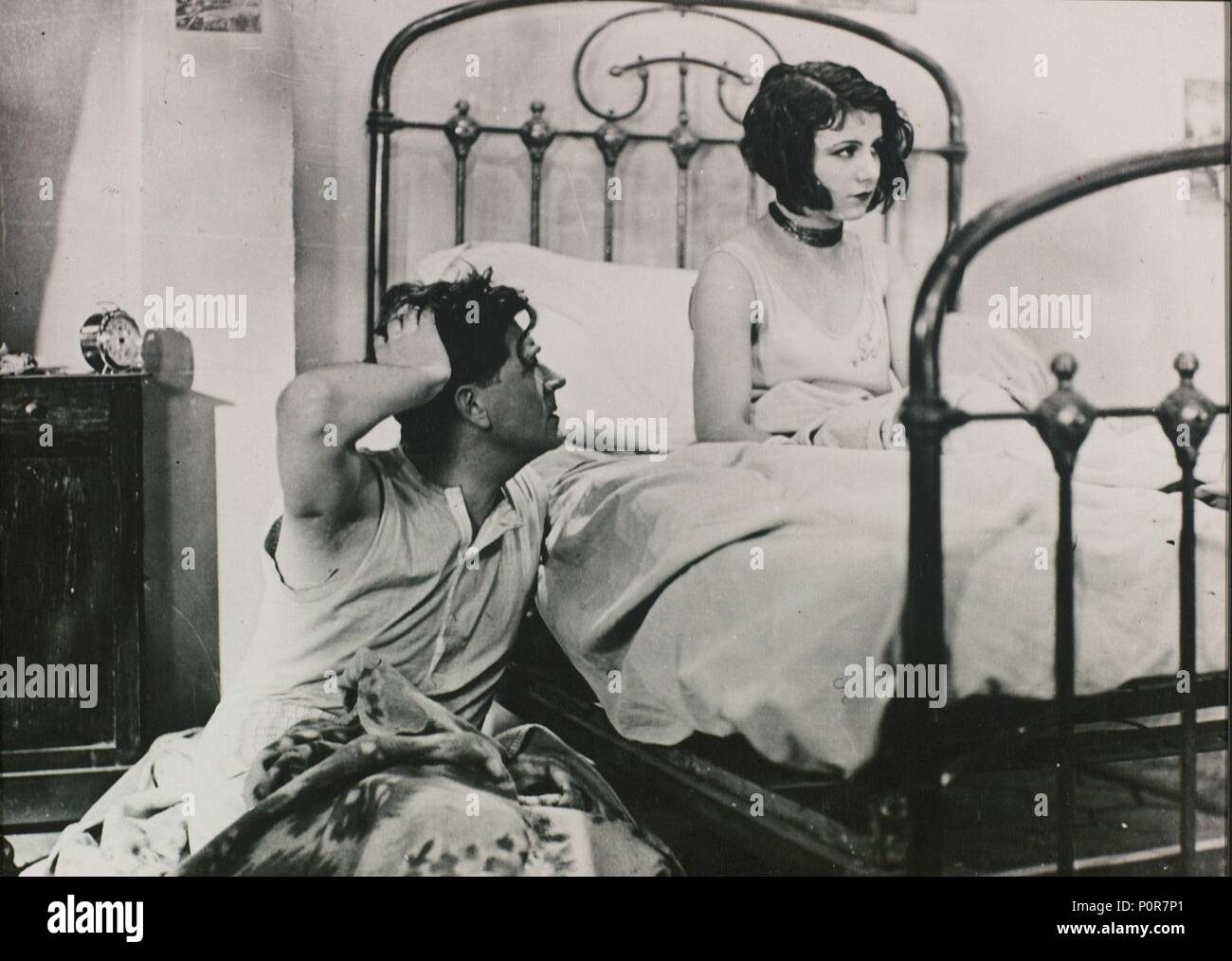 Original Film Title: SOUS LES TOITS DE PARIS.  English Title: UNDER THE ROOFS OF PARIS.  Film Director: RENE CLAIR.  Year: 1930.  Stars: ALBERT PREJEAN; POLA ILLERY. Stock Photo