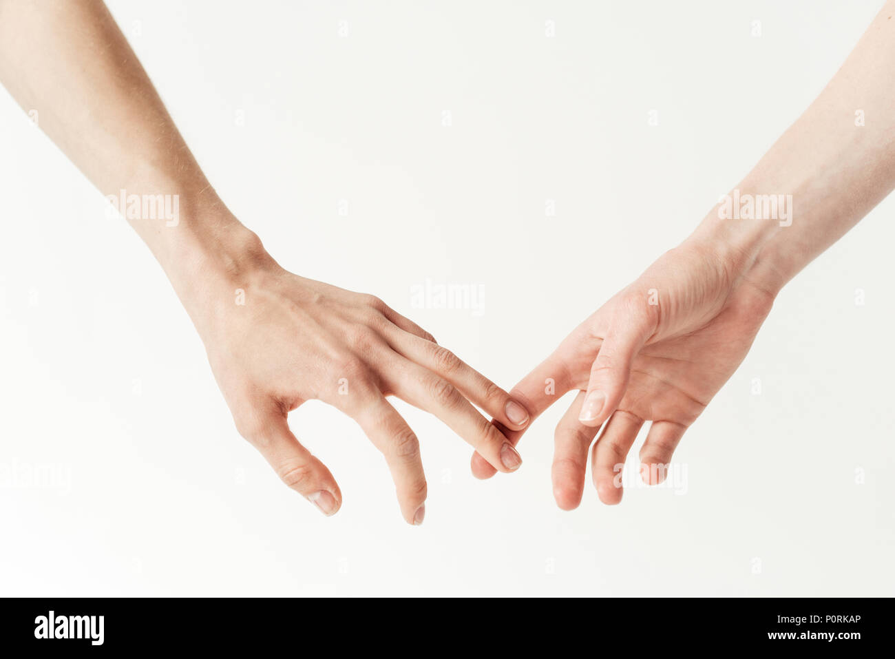 Cropped image of lesbians holding hands isolated on white Stock Photo
