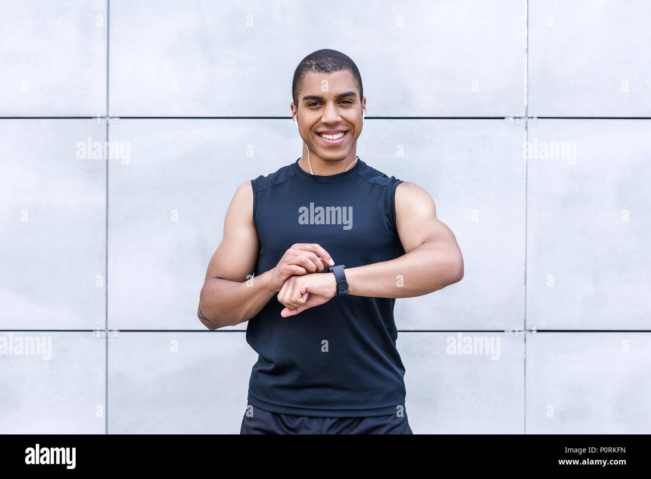 Smiling african american sportsman using hi-res stock photography and ...