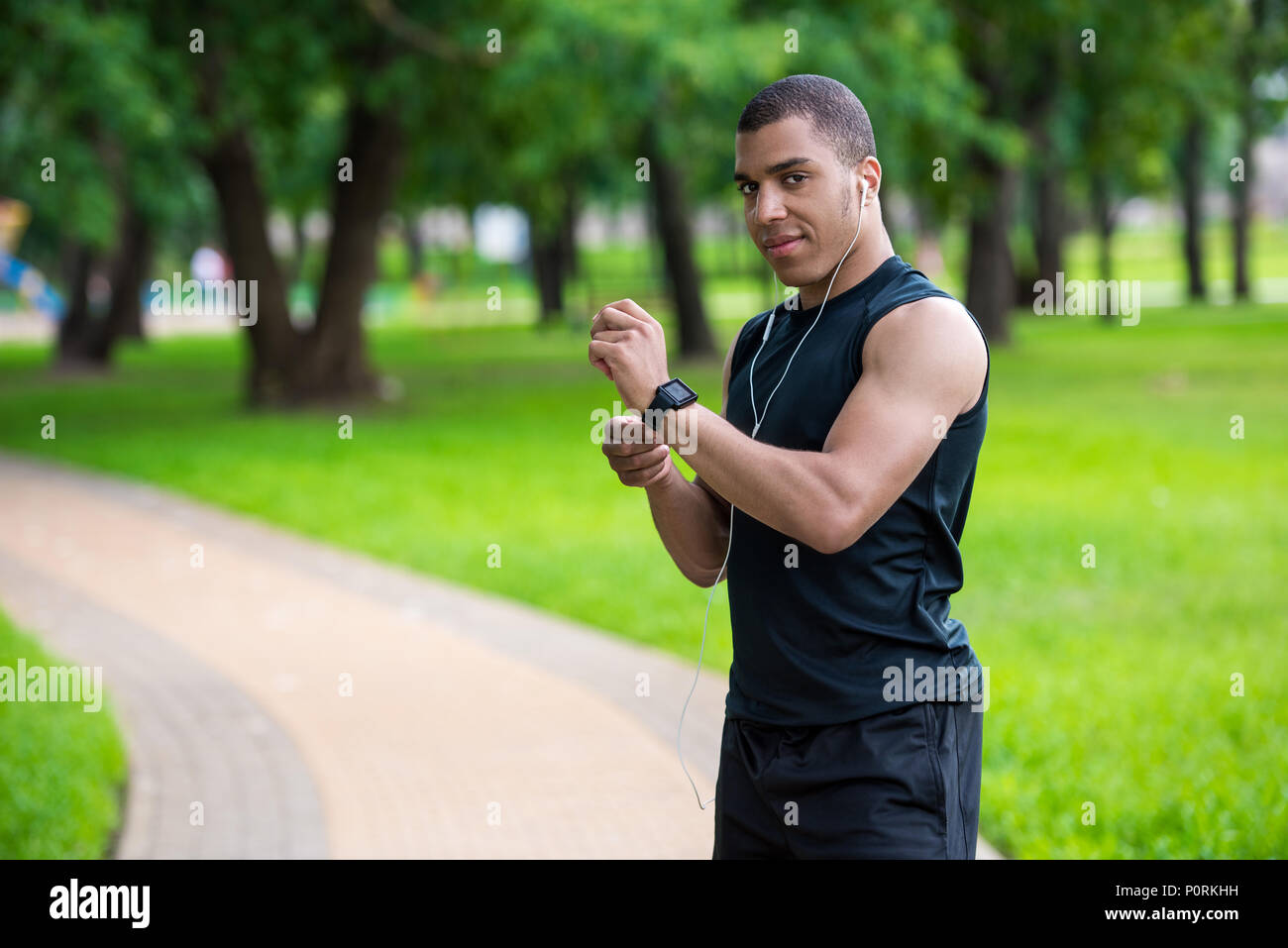 Smiling african american sportsman using hi-res stock photography and ...