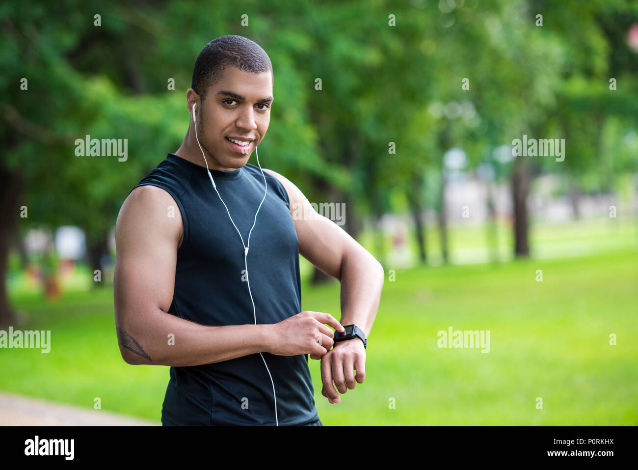 Smiling african american sportsman using hi-res stock photography and ...