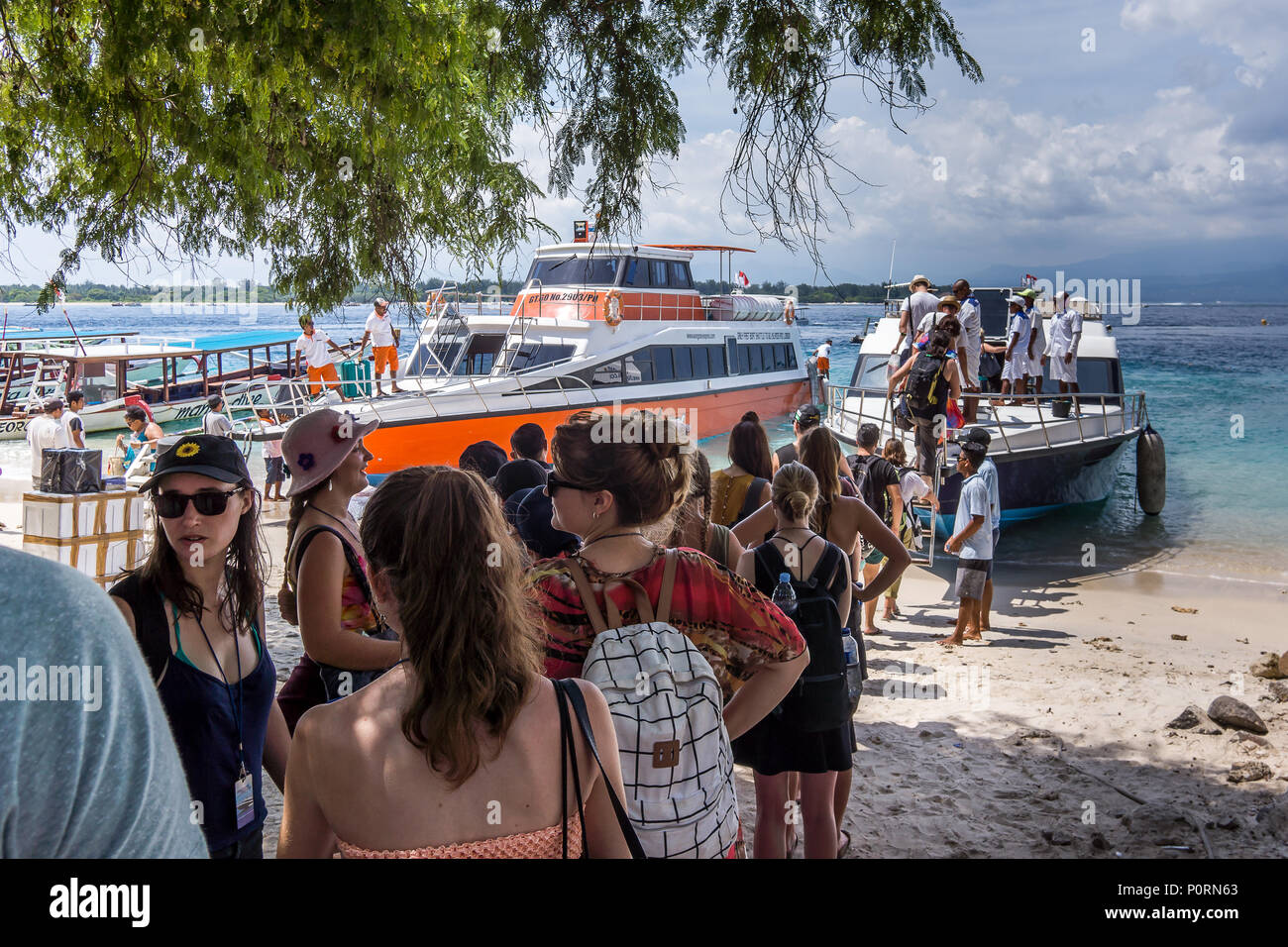 Speedboat to Bali from Gili Trawangan and Lombok, tourists standing in line, Indonesia, April 26, 2018 Stock Photo