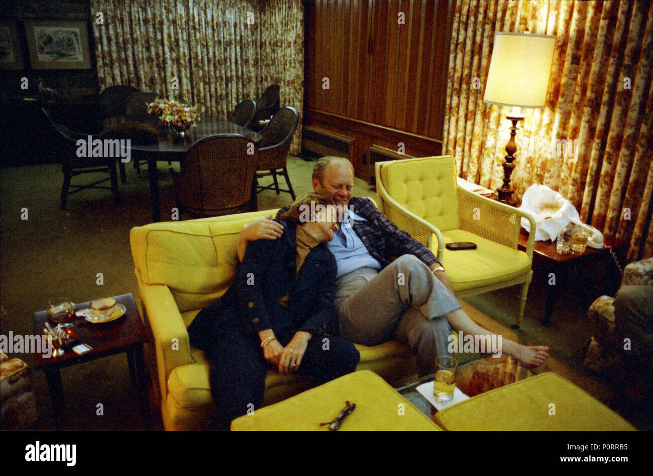 1974, September 2 – Camp David - Aspen Lodge - Living Room – Thurmont, MD – Gerald R. Ford, Betty Ford – seated on couch, snuggling - GRF and BF in robes – Labor Day Weekend Trip to Camp David, Maryland - Thurmont, Maryland Stock Photo