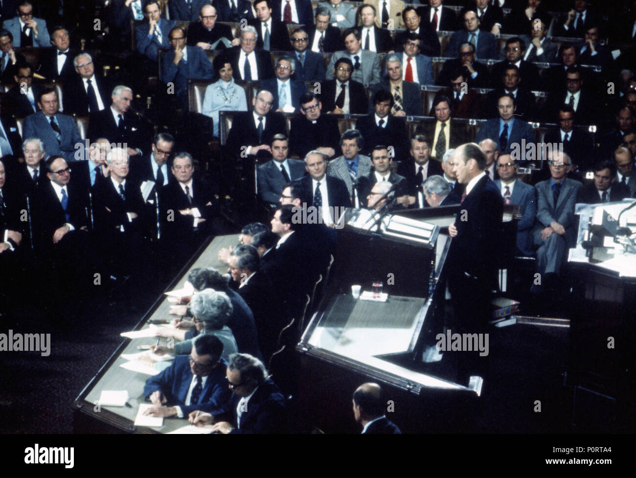 1975, January 15 – United States Capitol - House Chamber –  Gerald R. Ford, Rep. Albert, Rockefeller, Congress, Gallery, Guests – GRF at podium; others standing, applauding; seated in others - extreme long shot – State of the Union Address Stock Photo