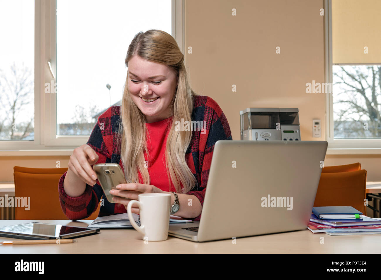 Attractive blonde woman talking hi-res stock photography and images - Alamy