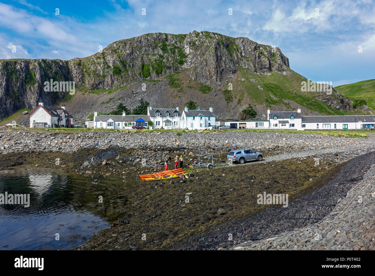 Kayaks being picked up in harbour in village of Easdale on the island of Seil south of  Oban Argyll & Bute Scotland UK Stock Photo