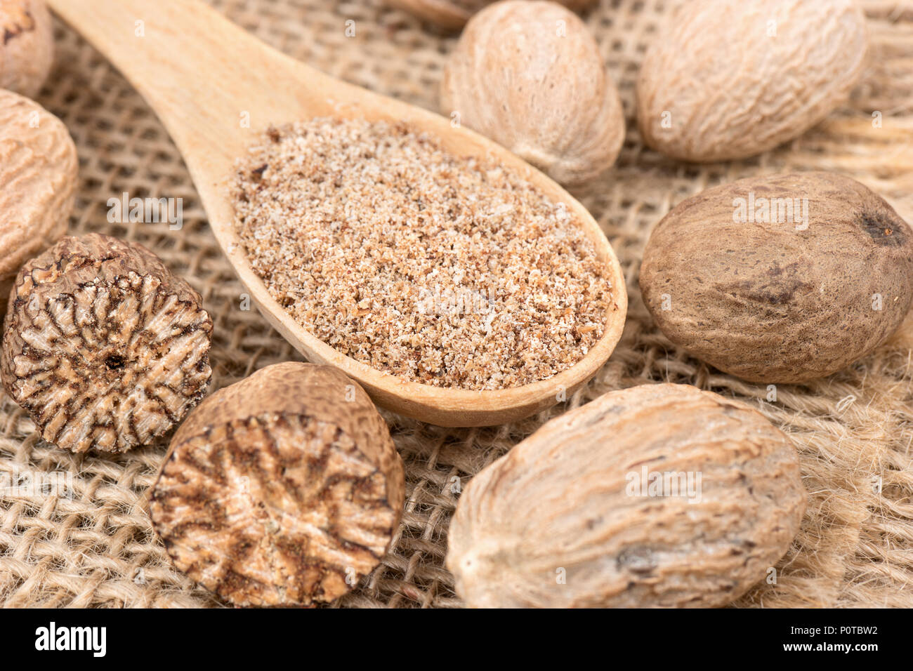 Spice Nutmeg In The Spoon With Scattered Nuts On Burlap Stock Photo Alamy