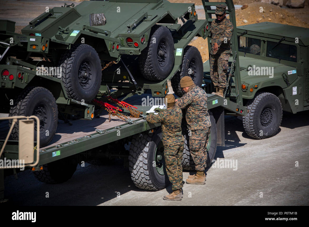 U.S. Marines with 2d Transportation Support Battalion (2d TSB), Combat Logistics Regiment 2, 2nd Marine Logistics Group, and Combat Logistics Regiment 45 (CLR-45) record serial numbers of equipment delivered to the assembly area during Strategic Mobility Exercise 17 (STRATMOBEX) near Stjørdal, Norway, May 4, 2017.  STRATMOBEX simulated a no-notice deployment for 2d TSB, CLR-45 and host nation entities in order to replicate likely contingency operations.  STRATMOBEX develops the U.S. Marine Corps’ ability to rapidly deploy forces anywhere in Europe and reassure allies and partners of our commit Stock Photo