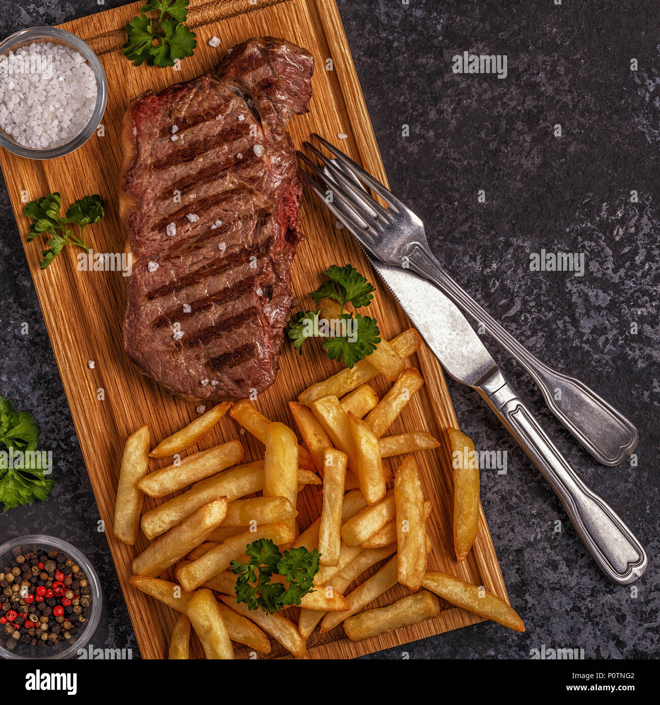 Beef barbecue steak with french fries, top view Stock Photo Alamy
