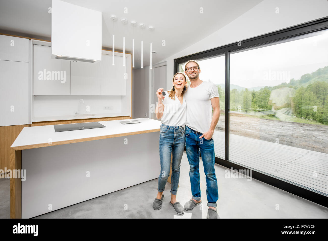 Happy couple in their new modern apartment Stock Photo - Alamy