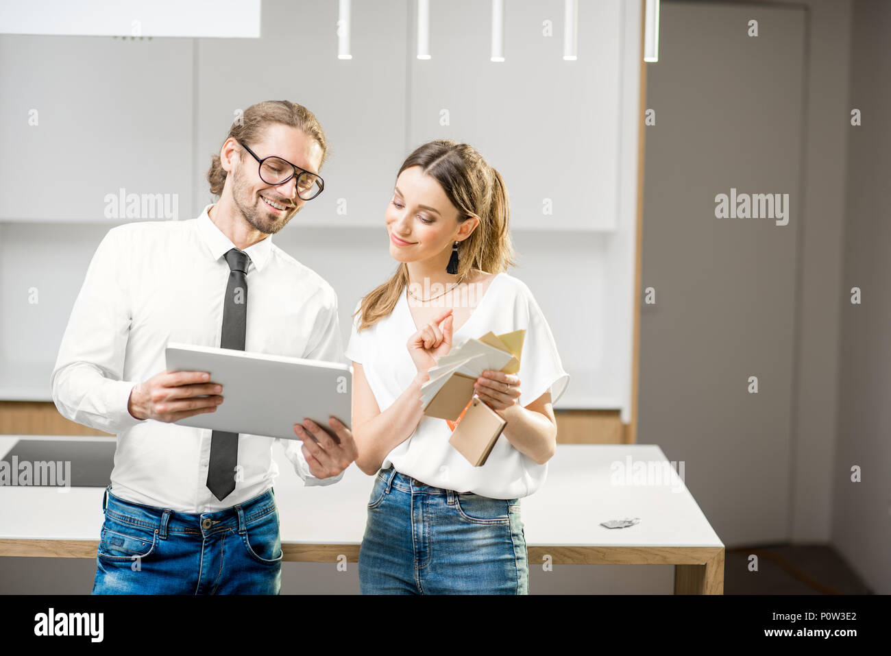 Couple planning home interior in the kitchen Stock Photo