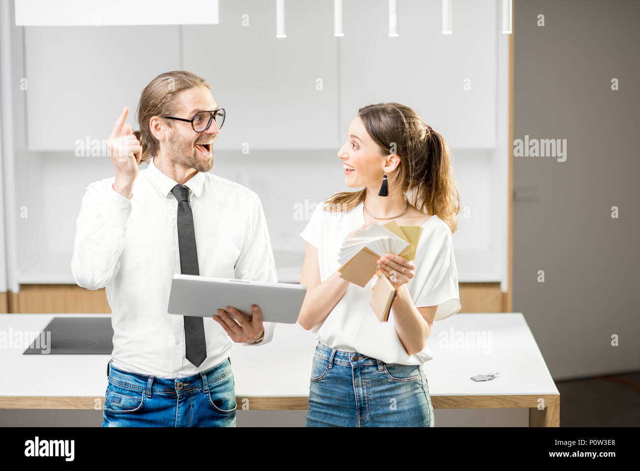 Couple planning home interior in the kitchen Stock Photo