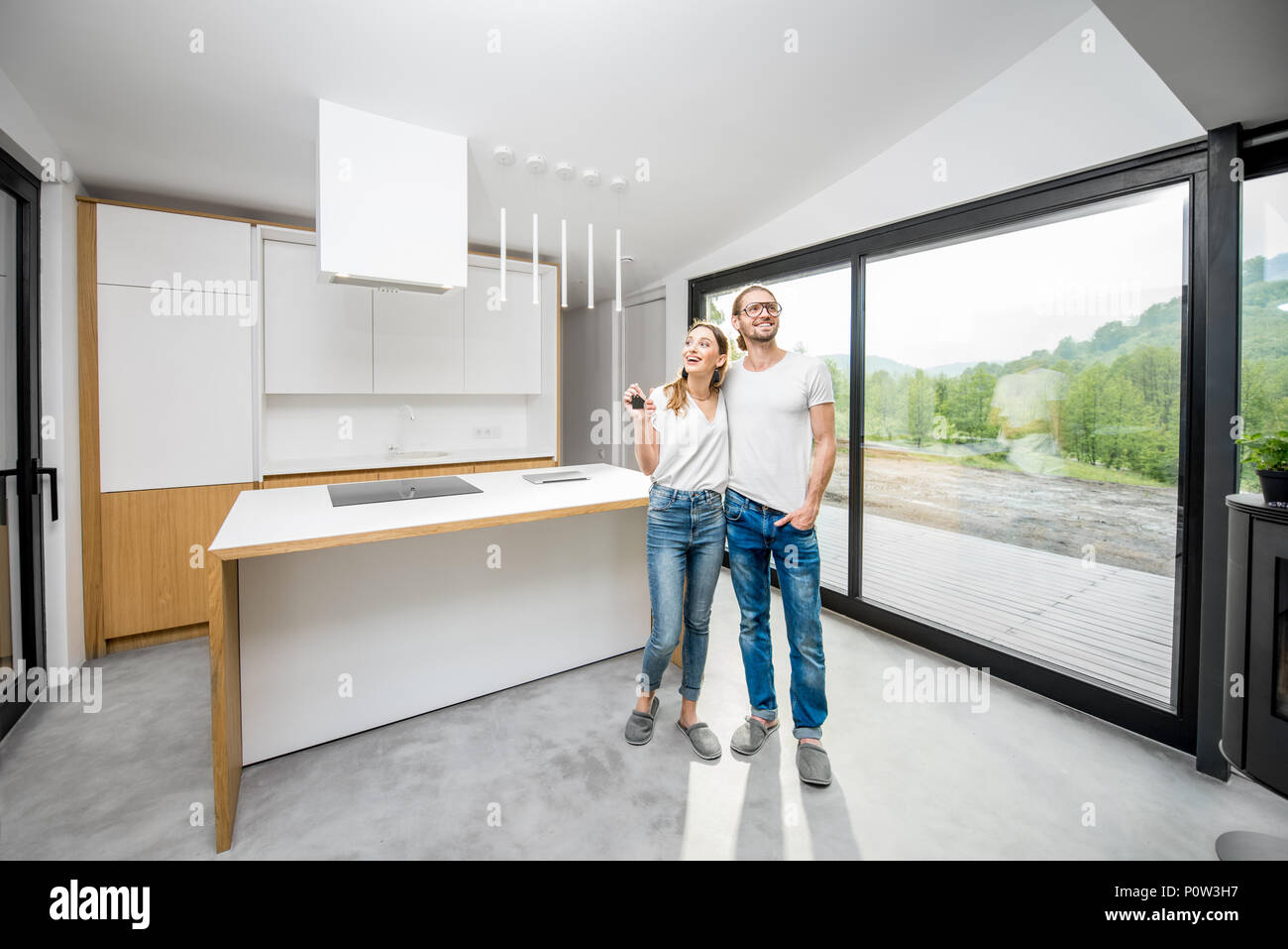 Happy couple in their new modern apartment Stock Photo - Alamy