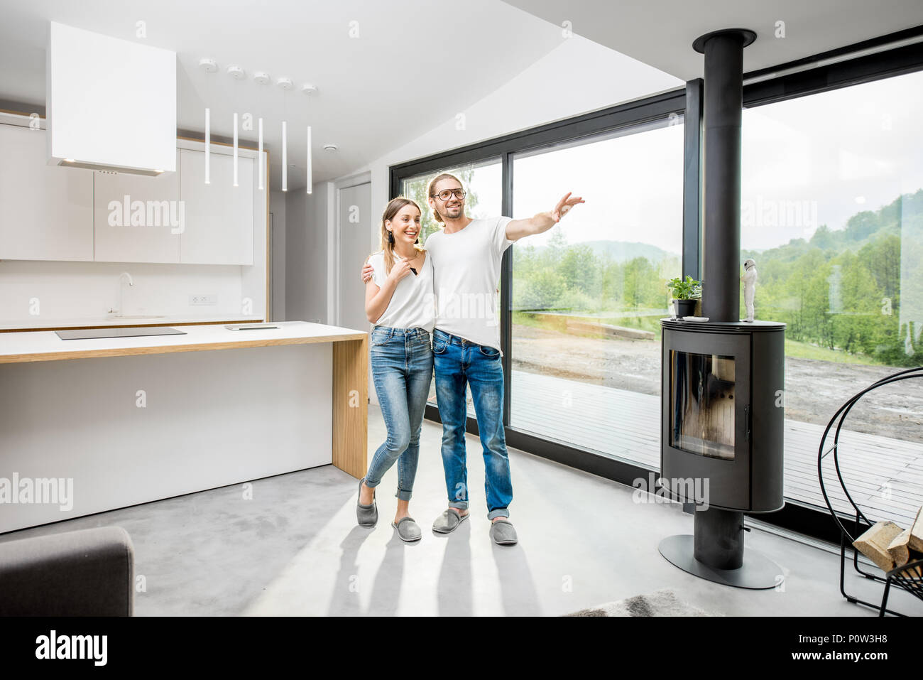 Happy couple in their new modern apartment Stock Photo - Alamy