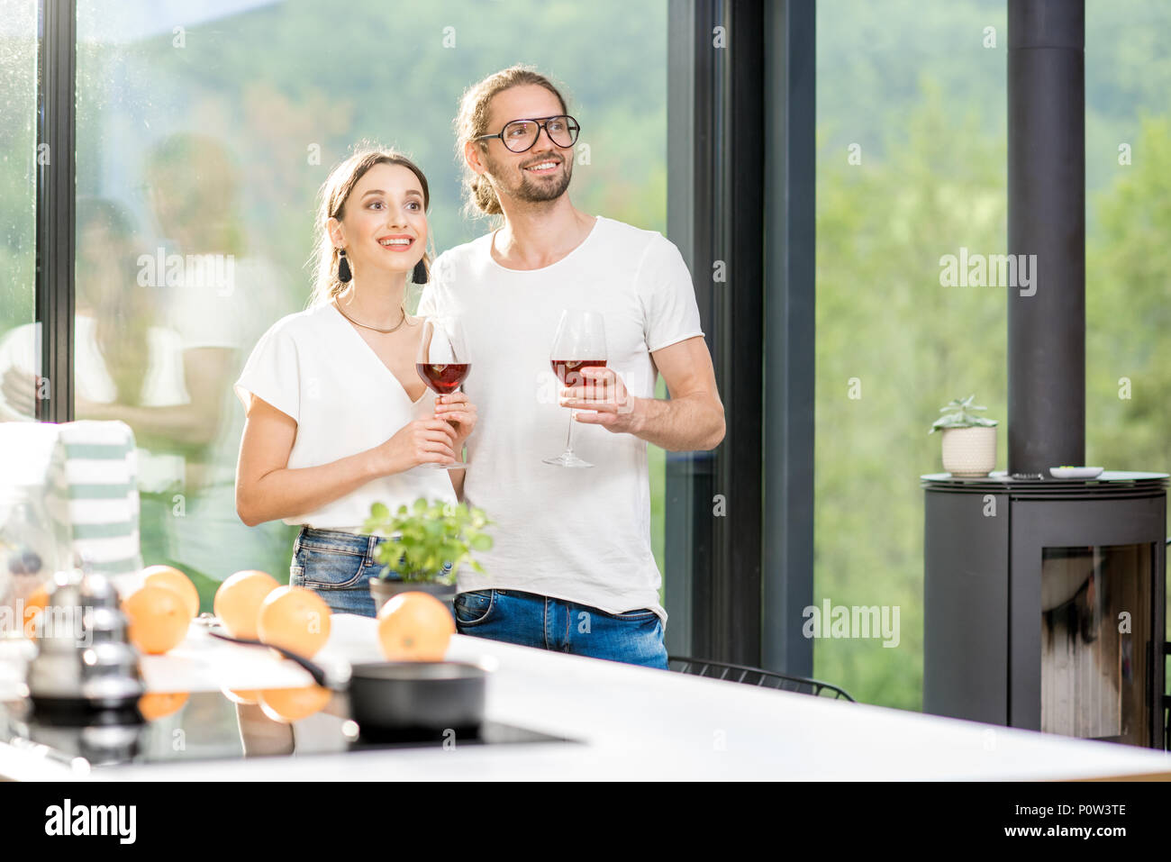 Young couple with wine at home Stock Photo