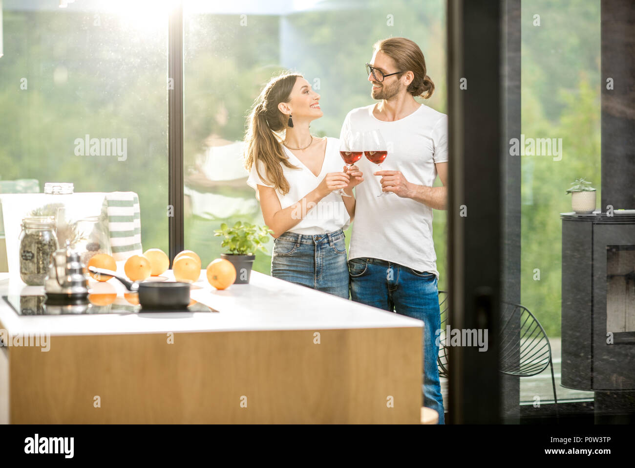 Young couple with wine at home Stock Photo