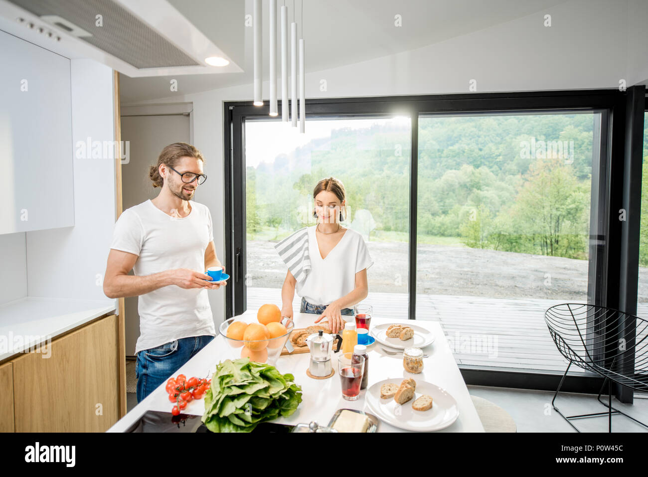 Young couple having breakfast at home Stock Photo
