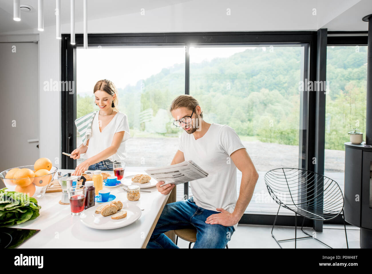 Young couple having breakfast at home Stock Photo