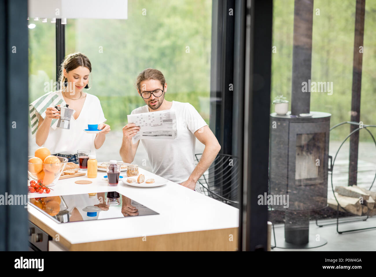Young couple having breakfast at home Stock Photo