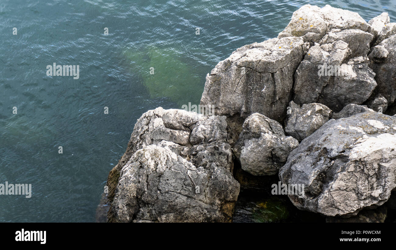 Clear Sea Rocks Clear and crystalline sea with white rocks Stock Photo - Alamy