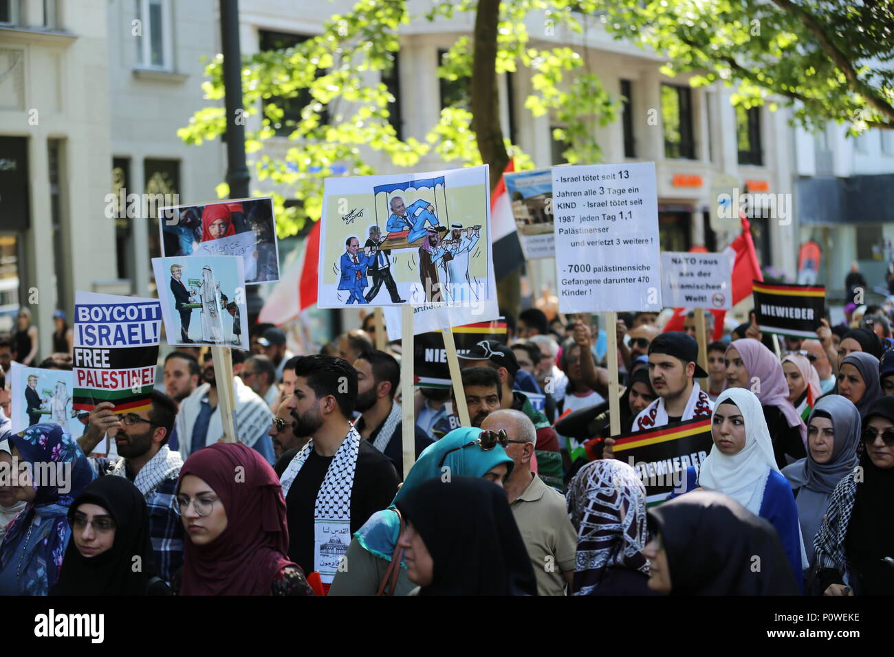 Berlin, Germany. 09th June, 2018. Approximately 2000 participants of the anti-Israel al-Quds demonstration are passing through Berlin. The police accompany the event with the utmost vigilance. Every year it comes to anti-Semitic incitement and crime. The protest now attracts extremists of the political spectrum, from sympathizers of Hamas and Hizballah to neo-Nazis. Motto of the event 'Crusade against Islam? Together against the injustice on the street!'. Credit: Simone Kuhlmey/Pacific Press/Alamy Live News Stock Photo