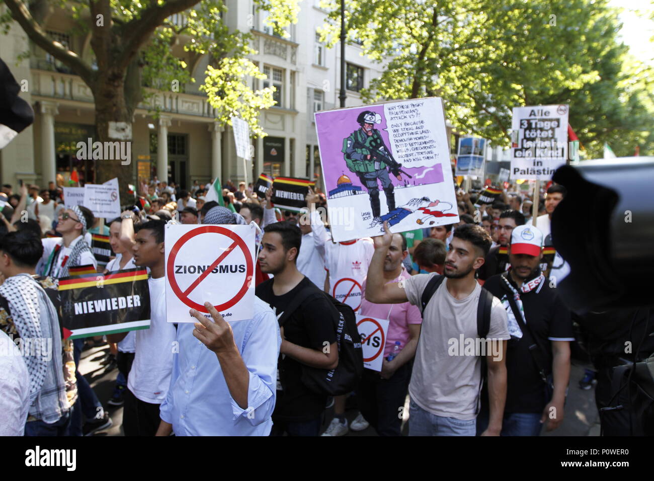 Berlin, Germany. 09th June, 2018. Approximately 2000 participants of the anti-Israel al-Quds demonstration are passing through Berlin. The police accompany the event with the utmost vigilance. Every year it comes to anti-Semitic incitement and crime. The protest now attracts extremists of the political spectrum, from sympathizers of Hamas and Hizballah to neo-Nazis. Motto of the event 'Crusade against Islam? Together against the injustice on the street!'. Credit: Simone Kuhlmey/Pacific Press/Alamy Live News Stock Photo