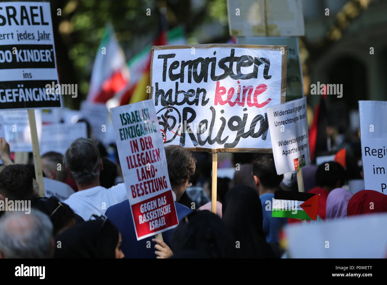 Berlin, Germany. 09th June, 2018. Approximately 2000 participants of the anti-Israel al-Quds demonstration are passing through Berlin. The police accompany the event with the utmost vigilance. Every year it comes to anti-Semitic incitement and crime. The protest now attracts extremists of the political spectrum, from sympathizers of Hamas and Hizballah to neo-Nazis. Motto of the event 'Crusade against Islam? Together against the injustice on the street!'. Credit: Simone Kuhlmey/Pacific Press/Alamy Live News Stock Photo