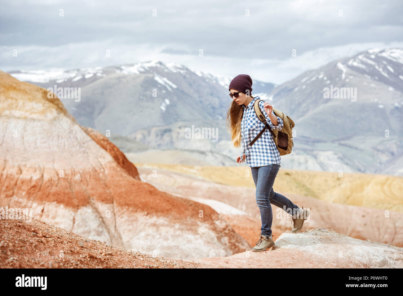 Girl hiker walking red mountains Stock Photo