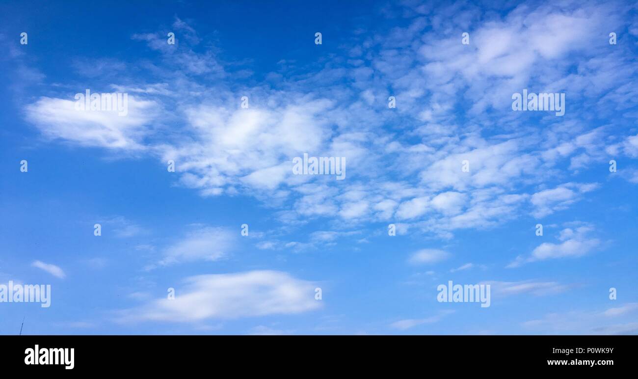Beautiful clouds against a blue sky background. Cloud sky. Blue sky with cloudy weather, nature cloud. White clouds, blue sky and sun Stock Photo