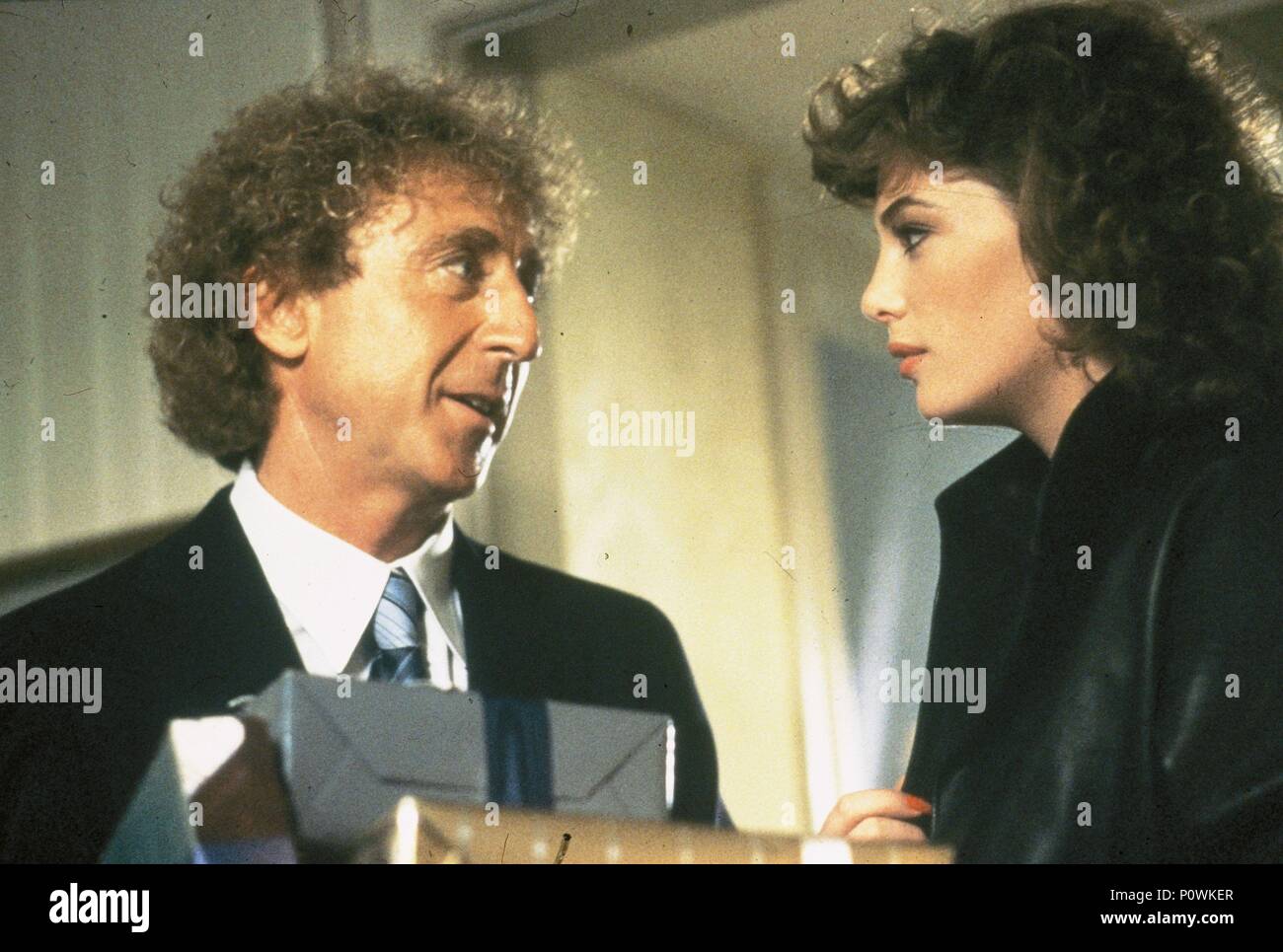 Original Film Title: THE WOMAN IN RED. English Title: THE WOMAN IN RED. Film  Director: GENE WILDER. Year: 1984. Stars: KELLY LEBROCK; GENE WILDER.  Credit: ORION PICTURES / Album Stock Photo - Alamy