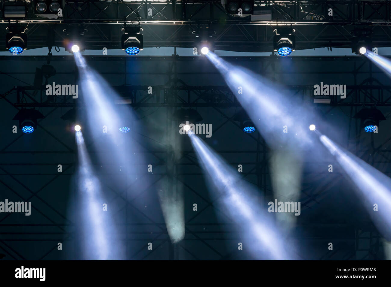 blue stage lights. spotlight equipment at outdoor concert  Stock Photo
